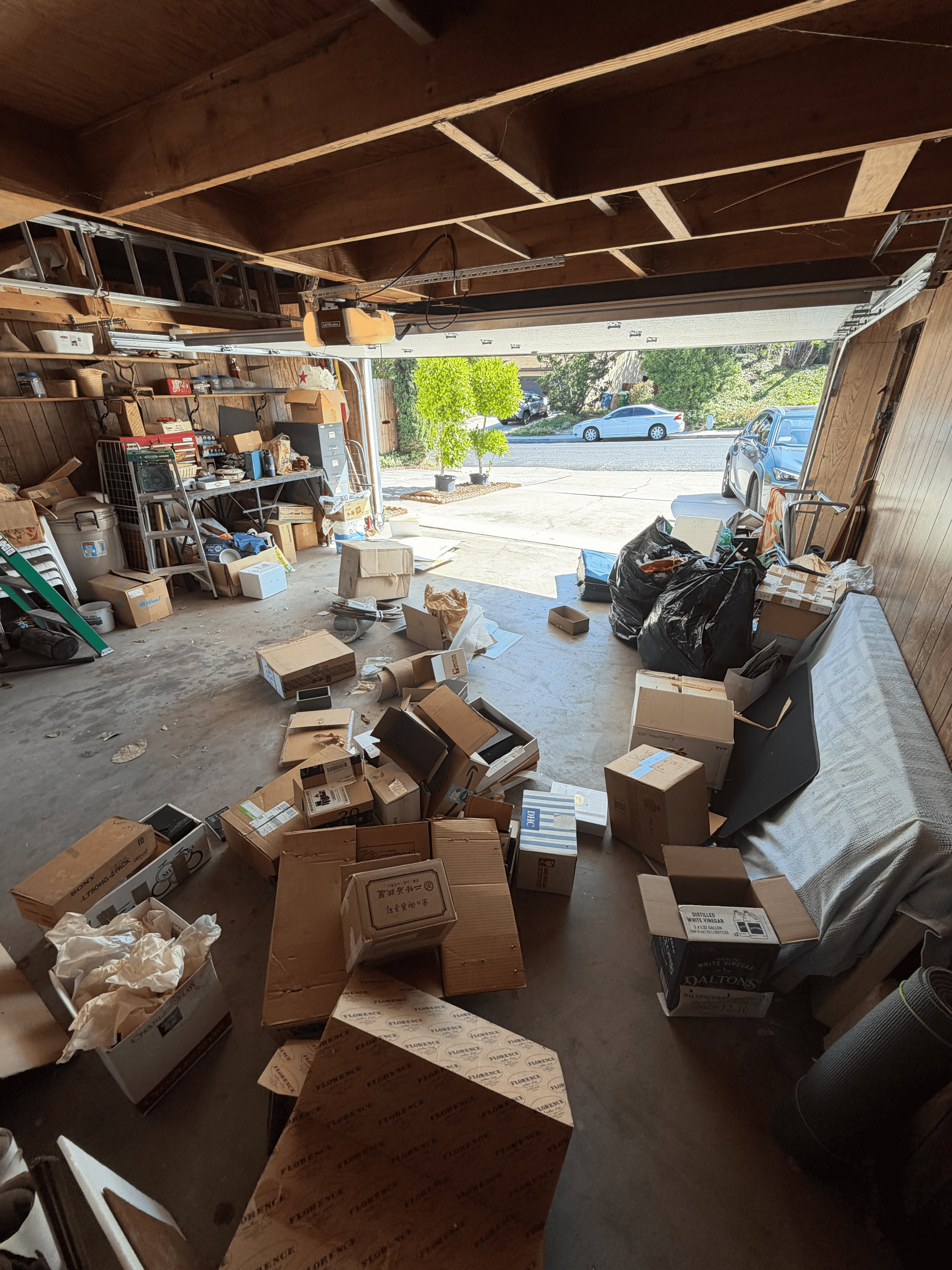 Packed cluttered garage before cleanout