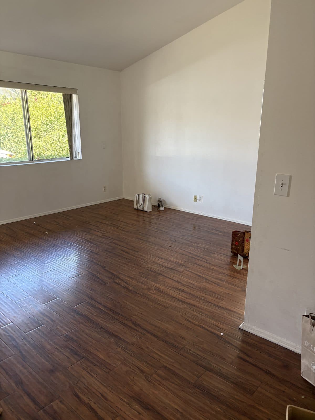 The same living room completely cleared after the move